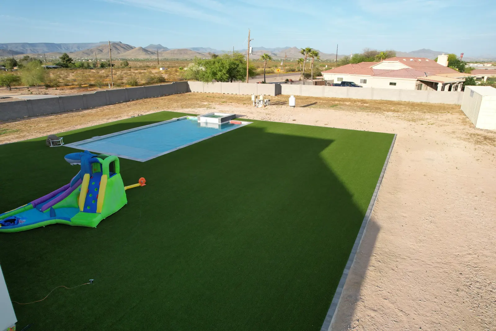 A seamless artificial grass lawn installed by The Turf Yard — joins hidden with seam tape